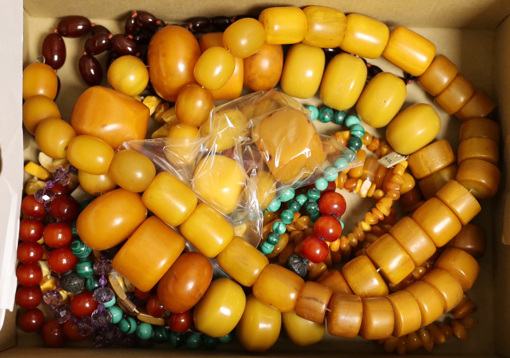 A group of assorted bead necklaces including amber
